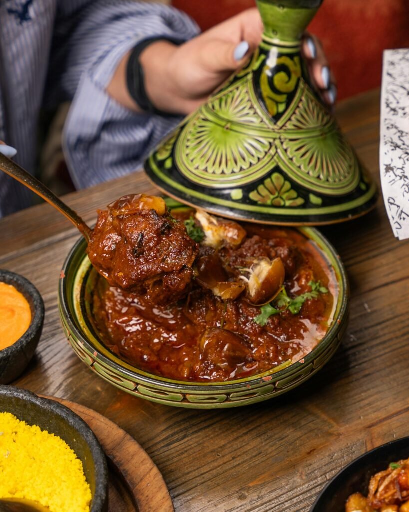 Authentic Moroccan lamb tagine served hot in a traditional dish. Perfect blend of flavors.